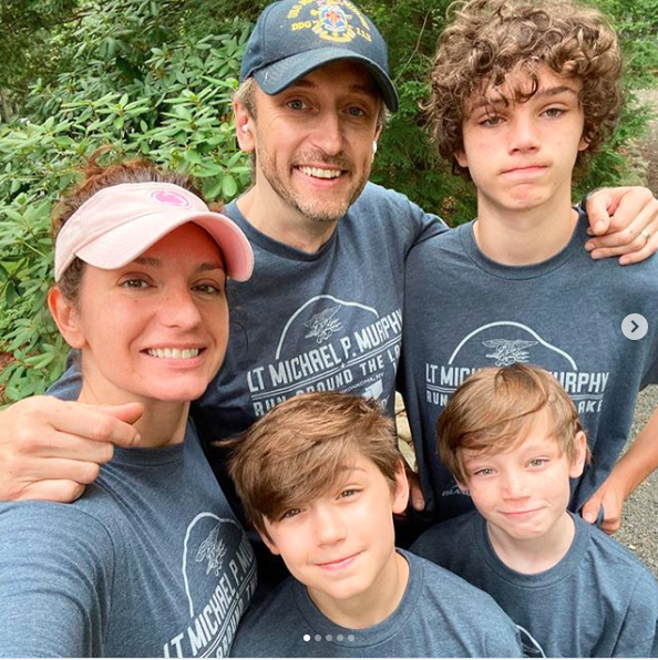 Mariusz is enjoying a happy fatherhood moment with his three sons; Michael, Justin, and Tyler alongside his wife.